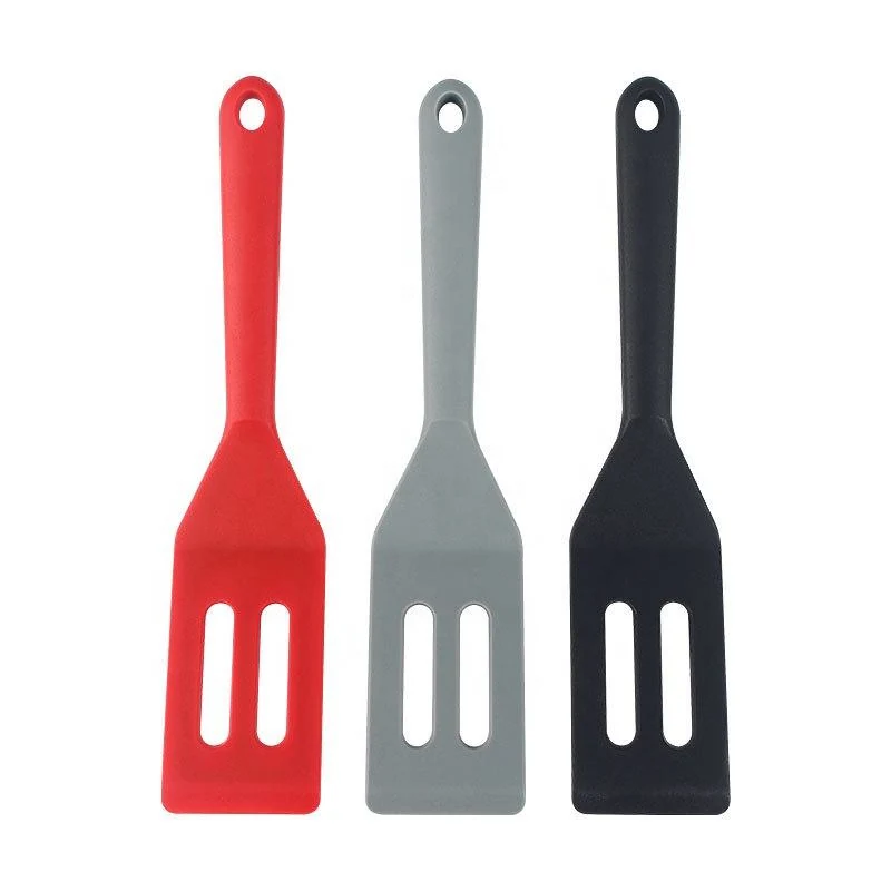 close detail highlighting the shallow flexible blade slides under low-profile baked goods